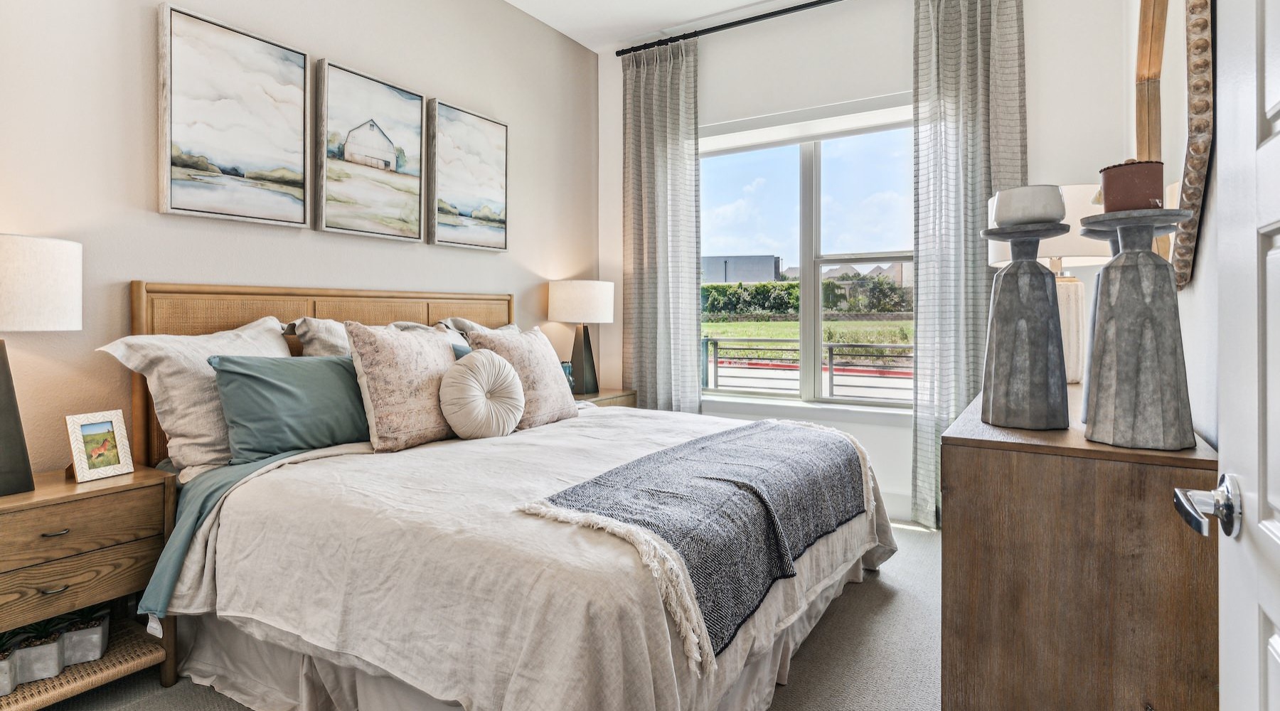 a bedroom with a bed and two nightstands