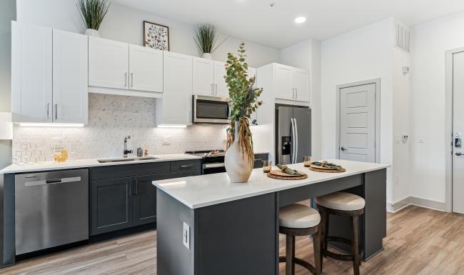 a kitchen with white cabinets