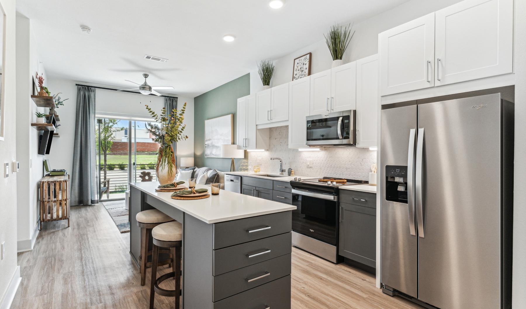 a kitchen with white cabinets