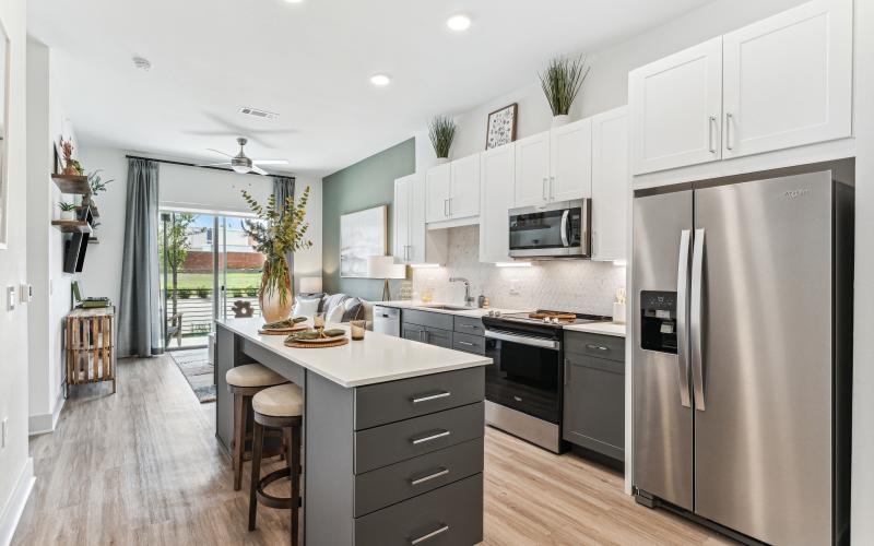 a kitchen with white cabinets